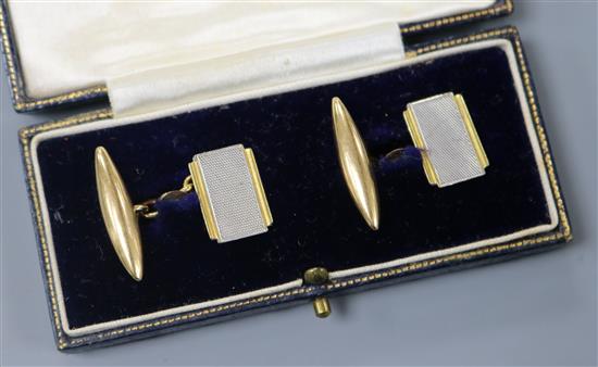 A pair of 18ct gold and platinum cufflinks.